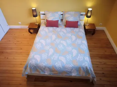 Un ou plusieurs lits dans un hébergement de l'établissement Chambre d'hôtes avec petit déjeuner