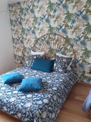Un ou plusieurs lits dans un hébergement de l'établissement Chambre à 5 minutes du circuit
