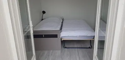 Un ou plusieurs lits dans un hébergement de l'établissement La Patalisse, maison type 3 et jardin