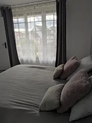 Un ou plusieurs lits dans un hébergement de l'établissement Chambre Ruaudin
