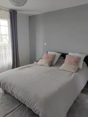 Un ou plusieurs lits dans un hébergement de l'établissement Chambre Ruaudin
