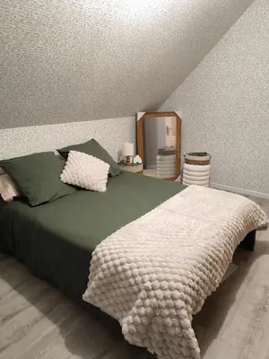 Un ou plusieurs lits dans un hébergement de l'établissement Chambre à louer proche circuit