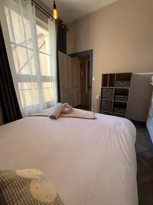 Un ou plusieurs lits dans un hébergement de l'établissement Côté Château - Grand appartement au cœur de Blois