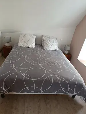 Un ou plusieurs lits dans un hébergement de l'établissement Gîte de la Grand Maison le Noyer