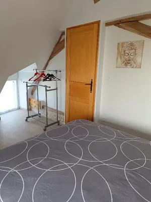 Un ou plusieurs lits dans un hébergement de l'établissement Gîte de la Grand Maison le Noyer
