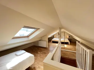 Un ou plusieurs lits dans un hébergement de l'établissement Villa Maignan 15 couchages 24h Le Mans