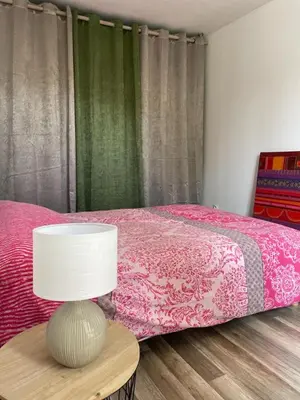 Un ou plusieurs lits dans un hébergement de l'établissement Maison Mimosa