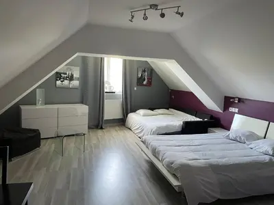Un ou plusieurs lits dans un hébergement de l'établissement Auberge du Château