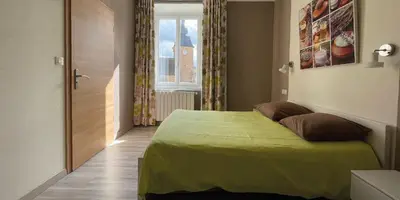 Un ou plusieurs lits dans un hébergement de l'établissement Auberge du Château