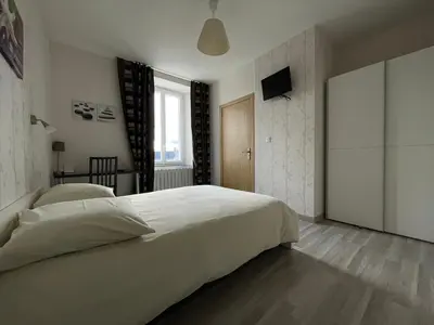 Un ou plusieurs lits dans un hébergement de l'établissement Auberge du Château