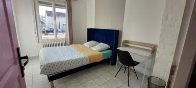 Un ou plusieurs lits dans un hébergement de l'établissement Maison proche du circuit des 24h avec parking