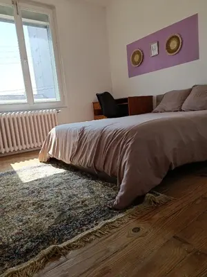 Un ou plusieurs lits dans un hébergement de l'établissement Maison proche du circuit des 24h avec parking