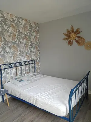 Un ou plusieurs lits dans un hébergement de l'établissement Appart 3 chambres
