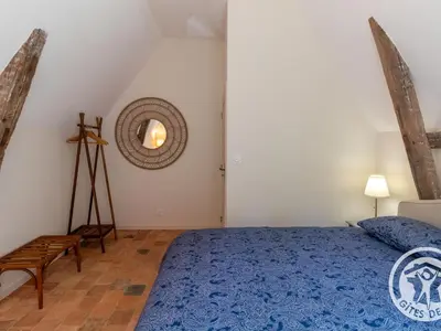 Un ou plusieurs lits dans un hébergement de l'établissement Gîte confortable au cœur du Maine-et-Loire, animaux admis - FR-1-622-58