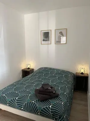 Un ou plusieurs lits dans un hébergement de l'établissement Appartement Centre de Guécélard