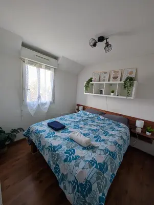 Un ou plusieurs lits dans un hébergement de l'établissement Appartement T3 - Relax aux portes des 24h du Mans