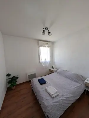 Un ou plusieurs lits dans un hébergement de l'établissement Appartement T3 - Relax aux portes des 24h du Mans