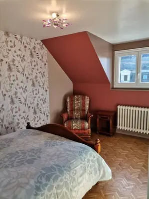 Un ou plusieurs lits dans un hébergement de l'établissement Grande maison de ville 120 m2 veranda et jardin.