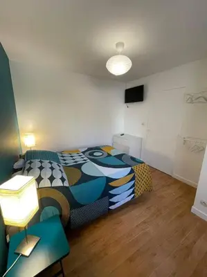 Un ou plusieurs lits dans un hébergement de l'établissement Maisonette parking privé gratuit