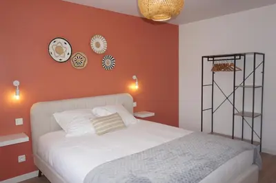 Un ou plusieurs lits dans un hébergement de l'établissement Riva Home