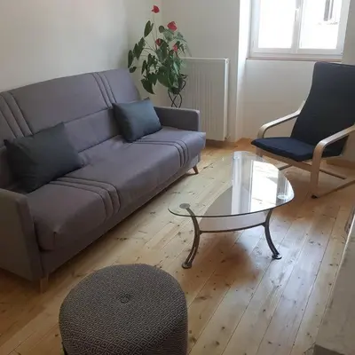 Coin salon dans l'établissement Appartement Malawo