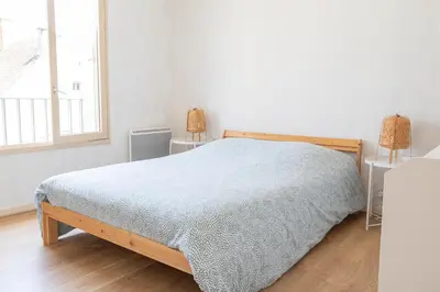 Un ou plusieurs lits dans un hébergement de l'établissement Charmant appartement - 5 mn Zoo de Beauval 4p