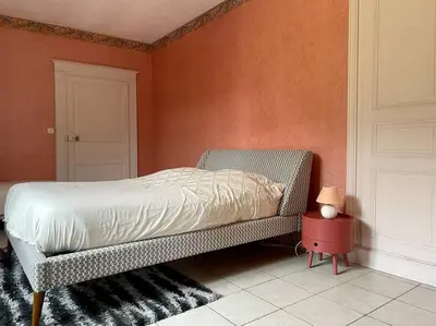 Un ou plusieurs lits dans un hébergement de l'établissement La maison bleue