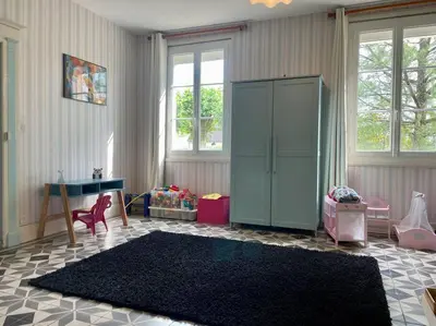 Un ou plusieurs lits dans un hébergement de l'établissement La maison bleue