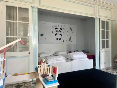 Un ou plusieurs lits dans un hébergement de l'établissement La maison bleue