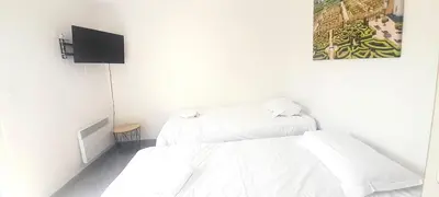 Un ou plusieurs lits dans un hébergement de l'établissement Appartement 8pers à Vallères