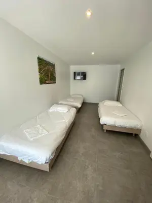 Un ou plusieurs lits dans un hébergement de l'établissement Appartement 8pers à Vallères