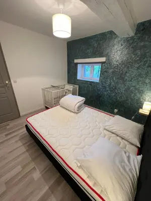 Un ou plusieurs lits dans un hébergement de l'établissement Gîte Les 4 Terres - Maison 2 chambres