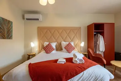 Un ou plusieurs lits dans un hébergement de l'établissement Domaine de la Courbe Hôtel & Spa