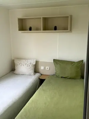 Un ou plusieurs lits dans un hébergement de l'établissement Mobilhome dans camping 4 étoiles, entre Châteaux, Beauval et Futuroscope