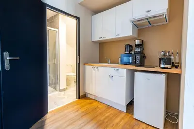 Cuisine ou kitchenette dans l'établissement L'Authentic
