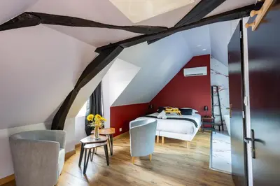 Un ou plusieurs lits dans un hébergement de l'établissement La Suite Rubis