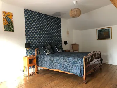 Un ou plusieurs lits dans un hébergement de l'établissement Maison-Gite Chez Roland