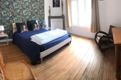 Un ou plusieurs lits dans un hébergement de l'établissement Maison-Gite Chez Roland