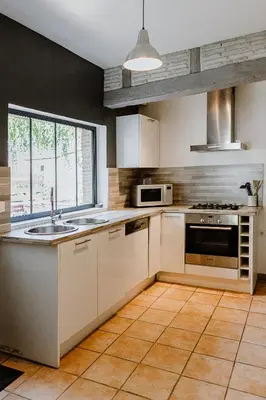 Cuisine ou kitchenette dans l'établissement Maison Madeleine