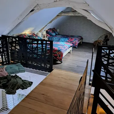 Un ou plusieurs lits dans un hébergement de l'établissement L'Atelier Gîte-Loft 6/8 pers