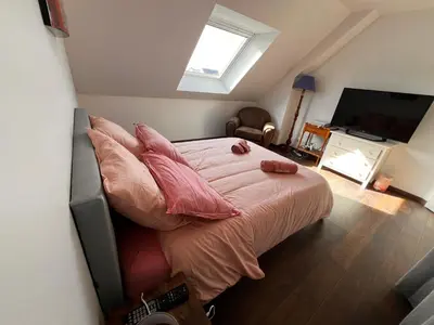 Un ou plusieurs lits dans un hébergement de l'établissement Maison chaleureuse tout confort