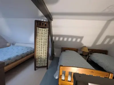 Un ou plusieurs lits dans un hébergement de l'établissement La dépendance, petite maison au calme 1Chambre
