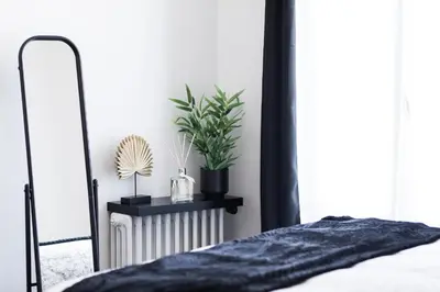 Un ou plusieurs lits dans un hébergement de l'établissement Appartement tout confort hyper centre, proche gare avec balcon