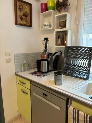 Cuisine ou kitchenette dans l'établissement Maison chaleureuse avec barbecue quartier calme