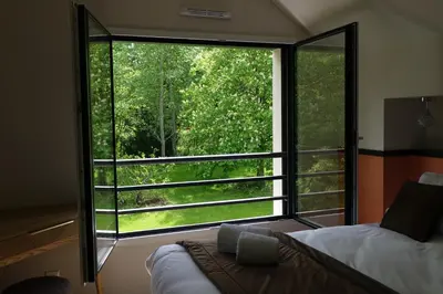 Un ou plusieurs lits dans un hébergement de l'établissement La Villa des Lys