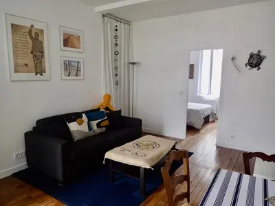 Coin salon dans l'établissement Appartement tempéré avec terrasse