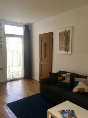 Coin salon dans l'établissement Appartement tempéré avec terrasse