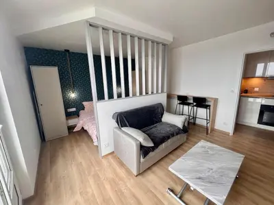 Coin salon dans l'établissement Appartement proche des prébendes