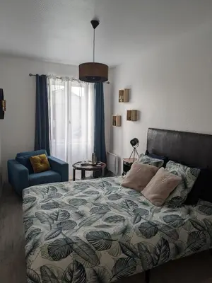 Un ou plusieurs lits dans un hébergement de l'établissement Les chambres du vieux quartier