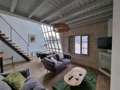 Coin salon dans l'établissement Superbe duplex La Verrière chic, cosy et spacieux
